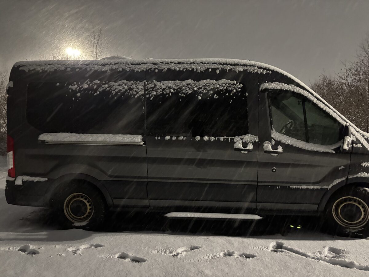 Side profile during active snowfall, useful for planning solar placement, service access, and snow-shedding behaviour.